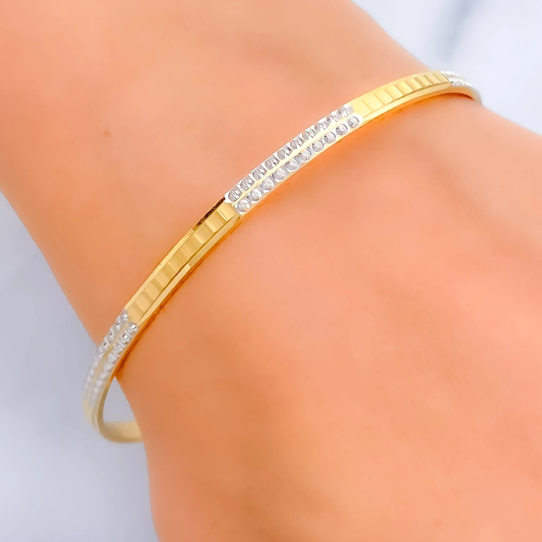 Alternating Glistening Two-Tone 22k Gold Bangle